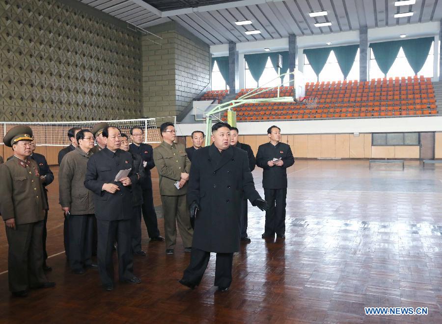Photo released by Korean Central News Agency (KCNA) on March 9, 2013 shows top leader of the Democratic People's Republic of Korea (DPRK) Kim Jong Un (front) inspecting the sports village in Chongchun Street, March 8, 2013. The village was built on the occasion of the 40th anniversary of the founding of the DPRK. It is a comprehensive sports and cultural centre with gymnasiums, sports persons' restaurant, hotels and welfare service facilities. (Xinhua/KCNA)