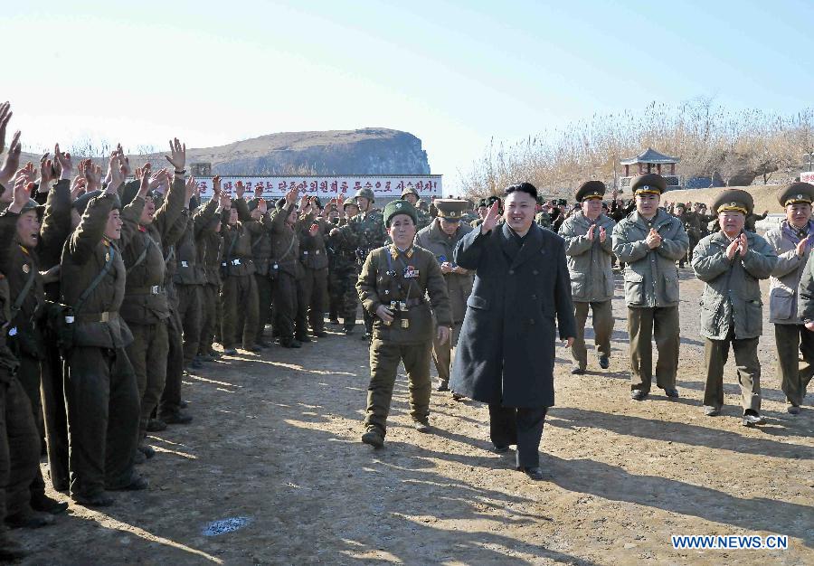 Photo released by KCNA news agency on March 12, 2013 shows Kim Jong Un, top leader of the Democratic People's Republic of Korea (DPRK), visiting the Wolnae-do Defence Detachment in the western front line, March 11, 2013. (Xinhua/KCNA) 