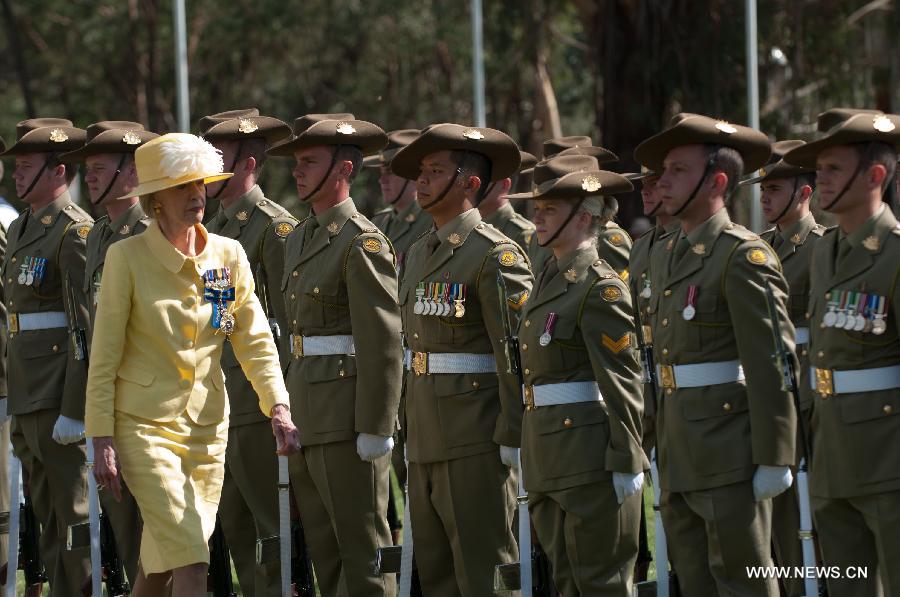Australia's Governor General Quentin Bryce (front) inspects the Australian Federal Guard at the Centenary of Canberra Foundation Stone Ceremony in Canberra, Australia, March 12, 2013. Canberra marked its 100th birthday on Tuesday. (Xinhua/Justin Qian)  