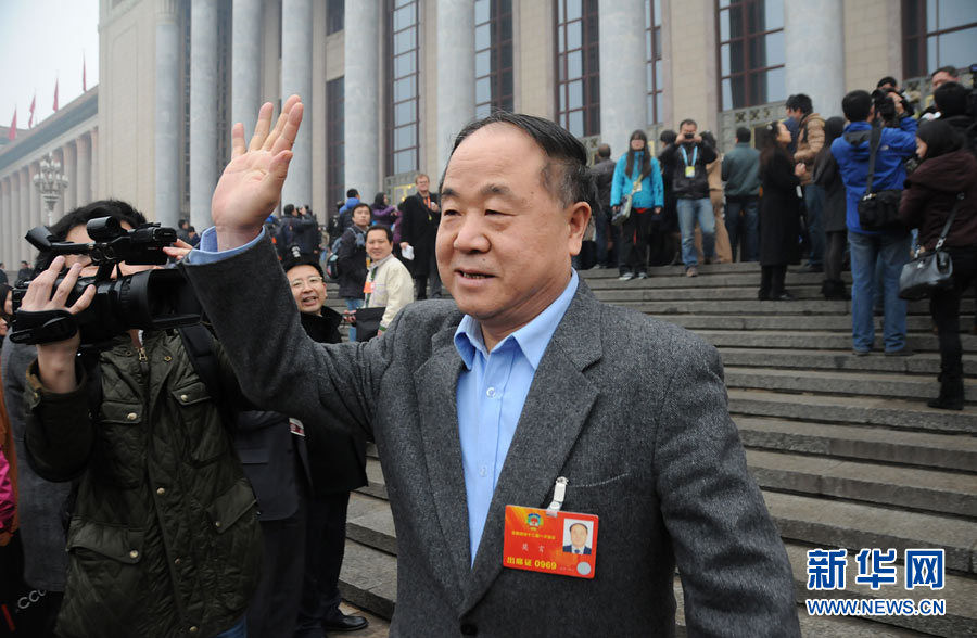 Mo Yan, member of the 12th National Committee of the Chinese People's Political Consultative Conference (CPPCC) says goodbye to reporters at the Great Hall of the People. The closing meeting of the first session of the 12th National Committee of the Chinese People's Political Consultative Conference (CPPCC) was held at the Great Hall of the People in Beijing, capital of China, March 12, 2013. (Xinhua News Agency/Zhai Zihe)