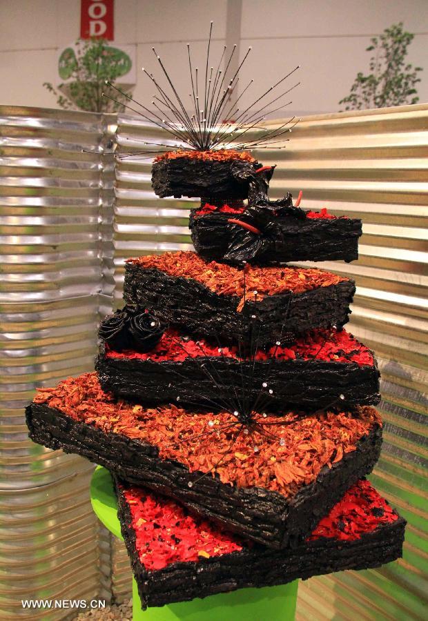 A "cake" made of plant materials is on display during the 17th Canada Blooms exhibition at the Canadian National Exhibition center in Toronto, Canada, March 15, 2013. As Canada's largest flower and garden festival, the 10-day event kicked off on Friday and was expected to attract over 200,000 visitors. (Xinhua/Ma Dan)