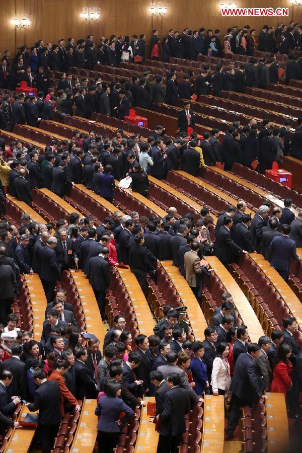 Deputies leave the venue after the sixth plenary meeting of the first session of the 12th National People's Congress (NPC) at the Great Hall of the People in Beijing, capital of China, March 16, 2013. (Xinhua/Jin Liwang) 