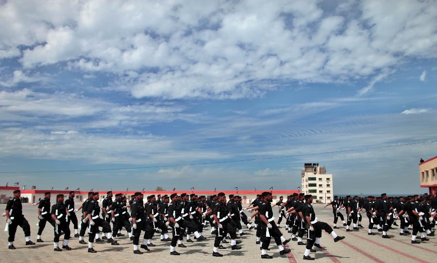 Palestinian police officers show their skills during their graduation ceremony at the police academy in Gaza City, on March 19, 2013. (Xinhua/Wissam Nassar)