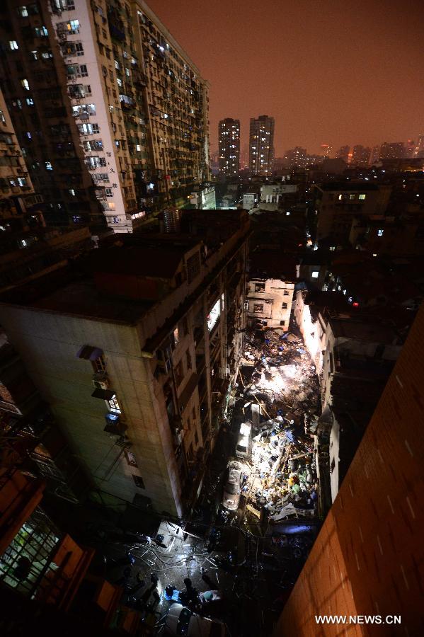 Photo taken on March 19, 2013 shows the blast locale of a residential building in Wuhan, capital of central China's Hubei Province. An explosion ripped through a residential building in Wuhan Tuesday night. Casualties from the blast that broke out at around 10 p.m. in Hanlai Square in the city's Hankou District are still unknown. (Xinhua/Cheng Min)