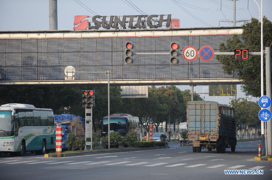 Photo taken on March 17, 2013 shows a solar-panel-covered overpass at the Suntech Power headquarters in Wuxi, east China's Jiangsu Province. China's leading solar panel maker Suntech Power, a New York-listed private company based in Wuxi, declared bankruptcy on Wednesday. (Xinhua/Shen Peng) 