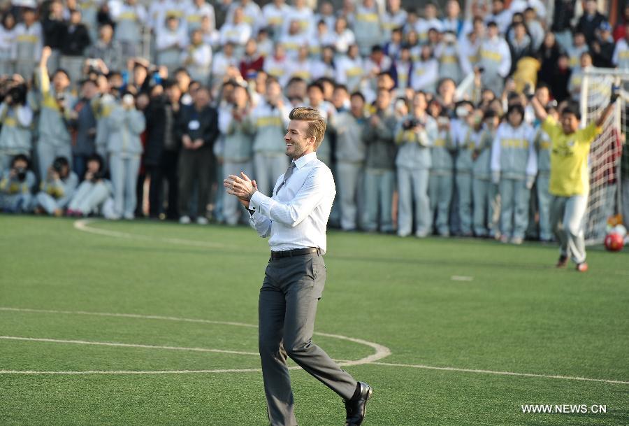 Beckham in Beijing, playing football in suits