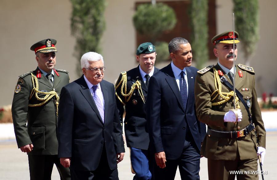 Palestinian President Mahmoud Abbas (2nd L) reviews honor guards with his U.S. counterpart Barack Obama (2nd R) upon his arrival in the West Bank city of Ramallah on March 21, 2013. Obama arrived in Tel Aviv in Israel Wednesday to start his Mideast tour. Obama will spend three days in Israel, the Palestinian territories and Jordan. (Xinhua/POOL/Fadi Arouri)