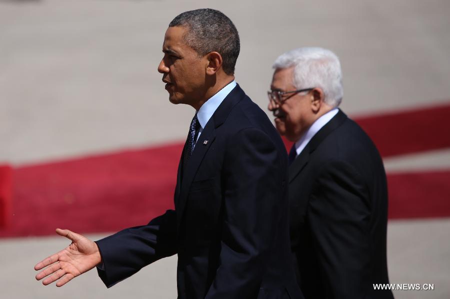 Palestinian President Mahmoud Abbas (R) talks with his U.S. counterpart Barack Obama upon his arrival in the West Bank city of Ramallah on March 21, 2013. Obama arrived in Tel Aviv in Israel Wednesday to start his Mideast tour. Obama will spend three days in Israel, the Palestinian territories and Jordan. (Xinhua/POOL/Fadi Arouri)
