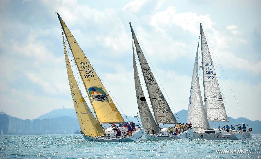 The sailing boats compete during the second day of racing at the 2013 Round Hainan International Regatta in Sanya, capital of south China's Hainan Province, March 22, 2013. (Xinhua/Guo Cheng)