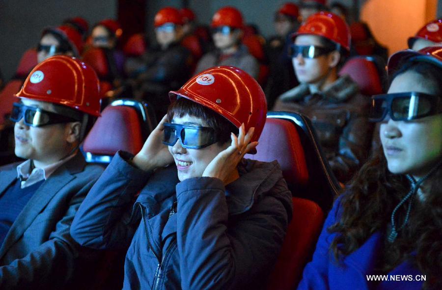 People watch a 4D movie at an underground cinema in the Kailuan national mine park in Tangshan, north China's Hebei Province, March 22, 2013. The 60-meter-deep cinema was reconstructed from a coal roadway which was built 130 years ago. The film showed in the cinema was about coal mining. (Xinhua/Zheng Yong)