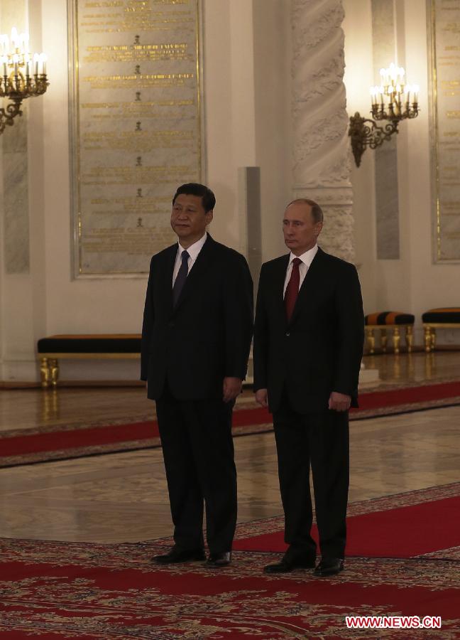 Chinese President Xi Jinping (L) is welcomed by Russian President Vladimir Putin at the Kremlin Palace in Moscow, capital of Russia, March 22, 2013. Chinese President Xi Jinping arrived in Moscow Friday for a state visit to Russia. (Xinhua/Lan Hongguang)