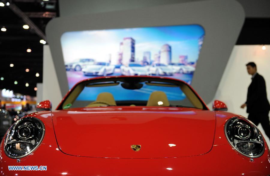 Photo taken on March 26, 2013 shows a Ferrari roadster being displayed during the press preview of the 34th Bangkok International Motor Show in Bangkok, Thailand. The 34th Bangkok International Motor Show will be held from March 27 to April 7. (Xinhua/Gao Jianjun)  