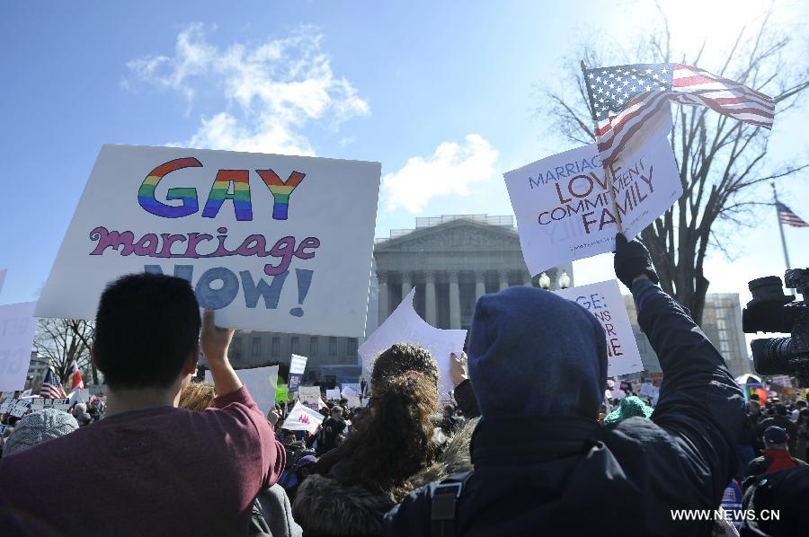 Supporters and opponents of same-sex marriage rally outside the U.S. Supreme Court in Washington D.C., capital of the United States, March 26, 2013. U.S. Supreme Court on Tuesday heard arguments of California's ban on same-sex marriage, opening two days of monumental proceedings on the issue. (Xinhua/Wang Yiou) 
