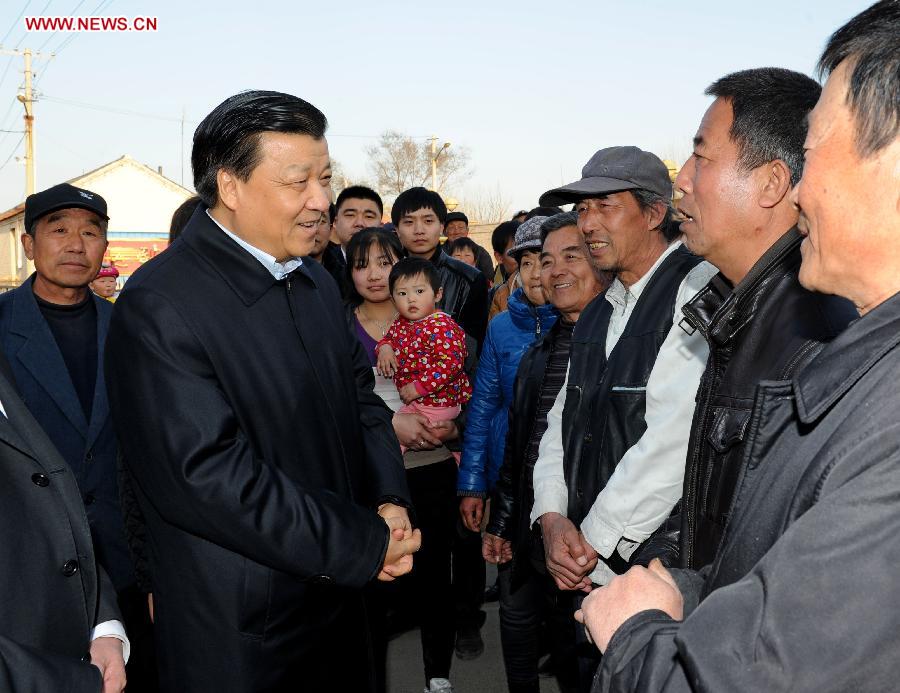 Photo taken on March 28, 2013 shows Liu Yunshan, a member of the Standing Committee of the Political Bureau of the Communist Party of China (CPC) Central Committee, talks with local villagers during an inspection in Tianjin Municipality, north China. Liu Yunshan made an inspection in Tianjin on Thursday afternoon and Friday. (Xinhua/Rao Aimin)