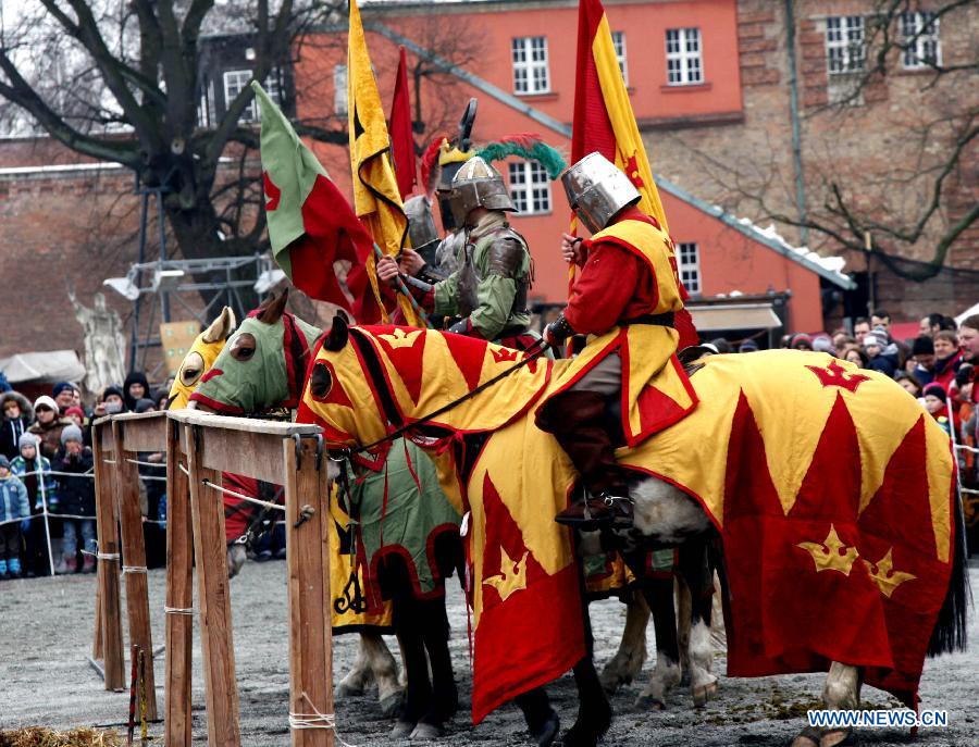 A squad of equestrians perform as the medieval knights during the annual Knight Festival, which opened in the Spandau Zitadelle (Citadel) in Berlin, March 30, 2013. A wide range of activities presenting the life and scene dating back to the European medieval times at the 3-day Knight Festival attracts many Berliners on outing during their Easter vacation.(Xinhua/Pan Xu)