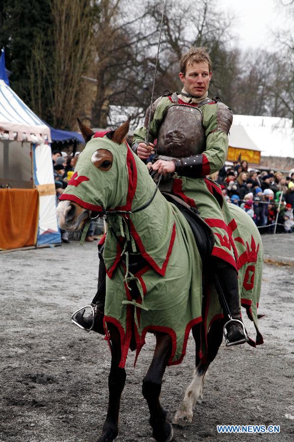 An equestrian performs as the medieval knight, during the annual Knight Festival, which opened in the Spandau Zitadelle (Citadel) in Berlin, March 30, 2013. A wide range of activities presenting the life and scene dating back to the European medieval times at the 3-day Knight Festival attracts many Berliners on outing during their Easter vacation. (Xinhua/Pan Xu)