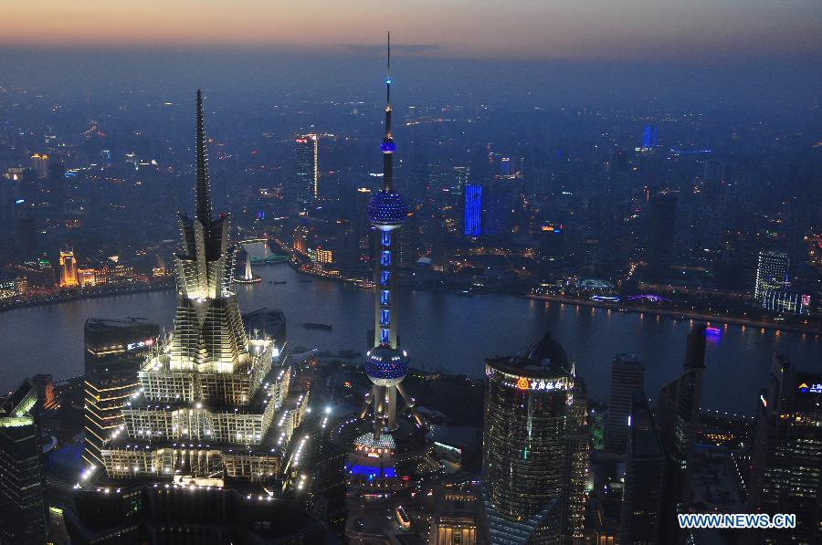 The Oriental Pearl TV Tower (C) is illuminated in blue light to mark the World Autism Awareness Day in Shanghai, east China, April 2, 2013. (Xinhua/He Youbao)