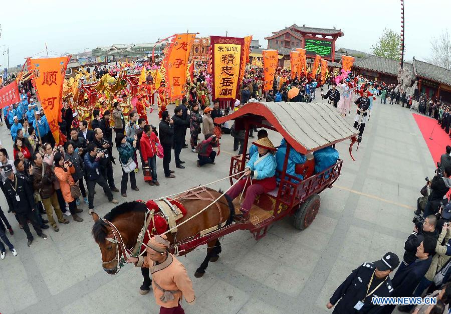 A carriage is seen during a spring parade for the upcoming Tomb-sweeping Day in Kaifeng, central China's Henan Province, April 3, 2013. Thousands of performers and citizens participated in the parade. (Xinhua/Wang Song)