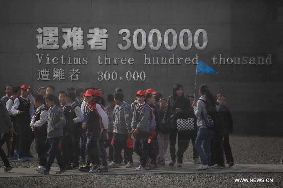 Students visit the Memorial Hall of the Victims in Nanjing Massacre by Japanese Invaders, in Nanjing, capital of east China's Jiansu Province, April 3, 2013. Lots of citizens came here to mourn Nanjing Massacre victims on the occassion of Qingming Festival, or Tomb-Sweeping Day, which falls on April 4 this year. (Xinhua/Han Hua)