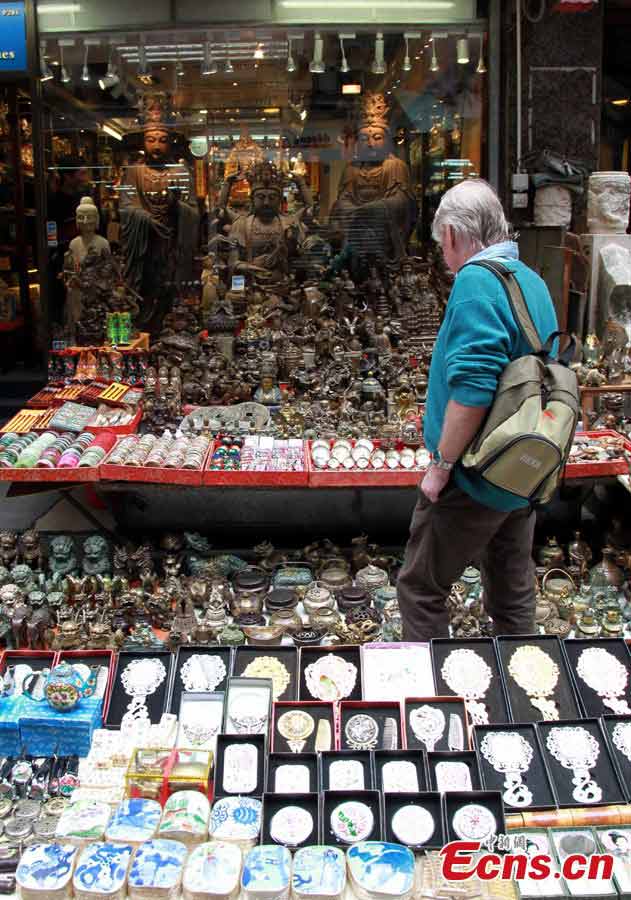 A foreigner shops in Upper Lascar Row in Hong Kong, April, 8, 2013. The Upper Lascar Row is parallel to the Hollywood Road in Sheung Wan and today, is an awesome alleyway for antiques and rare finds in all of Hong Kong. (CNS/Hong Shaokui)