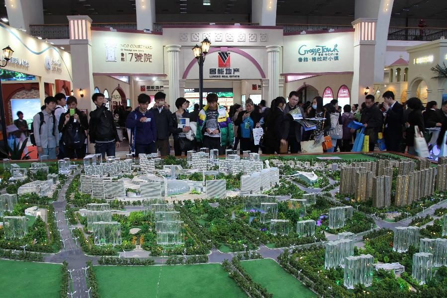 People visit 2013 Spring Beijing International Property Expo in Beijing, capital of China, April 11, 2013. The four-day expo kicked off on Thursday at Beijing Exhibition Centre. (Xinhua/Wang Yueling)