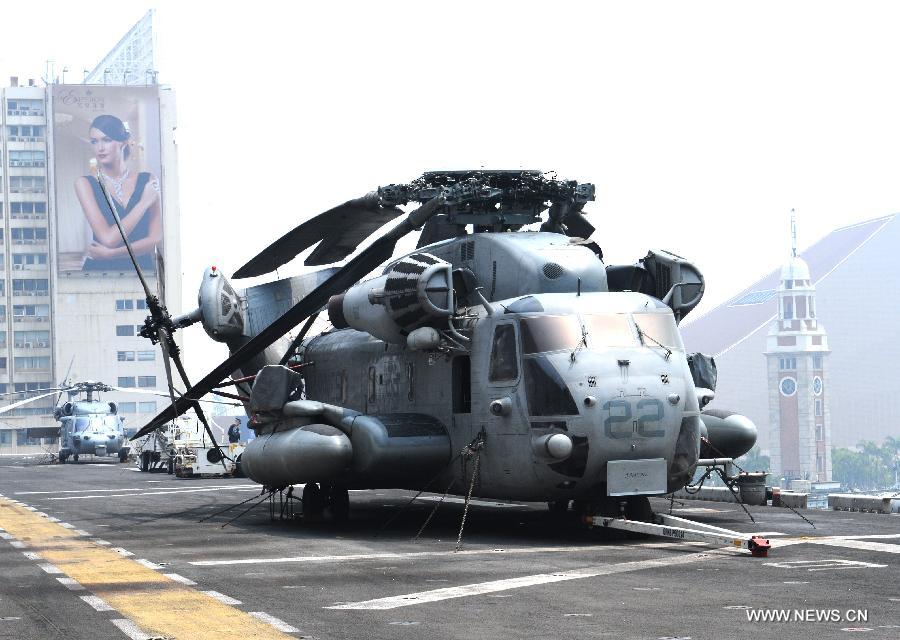 A U.S. navy helicopter is pictured on the USS Peleliu, the flagship of the Amphibious Squadron Three, in Hong Kong, south China, April 15, 2013. Three ships of the U.S. navy Amphibious Squadron Three started to make a port visit in Hong Kong on Monday to get replenishment. USS Peleliu pulled into the Ocean Terminal besides Tsim Sha Tsui, on the northern bank of the landmark Victoria Harbor in the morning. The other two ships anchored in waters outside the Harbor. (Xinhua/Wong Pun Keung) 