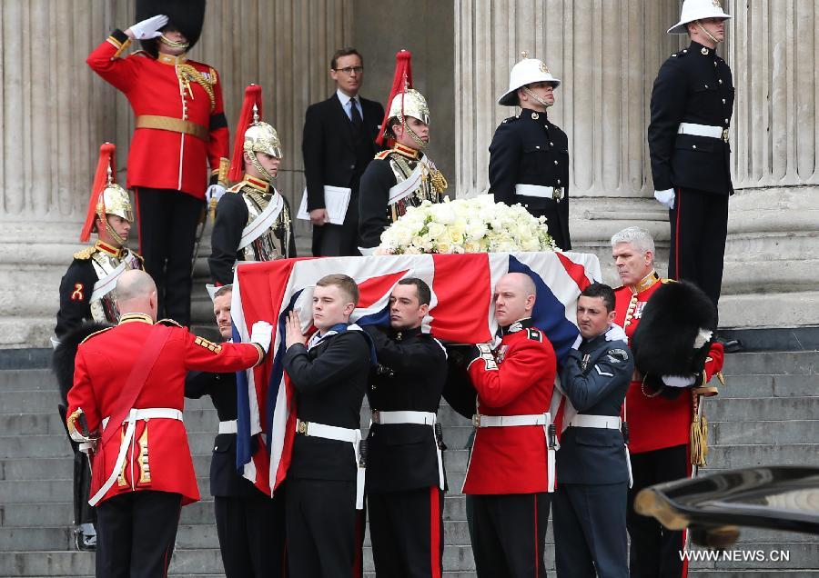 The coffin of British former prime minister Margaret Thatcher is carried out of St. Paul's Cathedral following the ceremonial funeral service in London, Britain, April 17, 2013. The funeral of Margaret Thatcher, the first female British prime minister, started 11 a.m. local time on Wednesday in London. (Xinhua/Yin Gang)