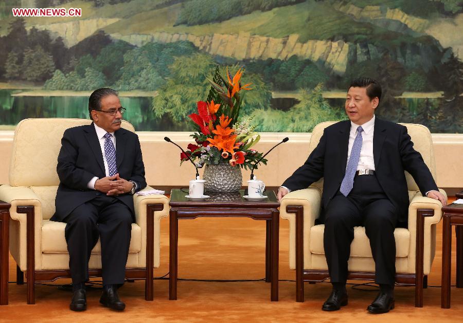 Chinese President Xi Jinping (R) meets with Prachanda, the Chairperson of Unified Communist Party of Nepal-Maoist, in Beijing, capital of China, April 18, 2013. (Xinhua/Pang Xinglei)