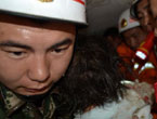 Firemen rescue a girl from debris in Lushan County of Ya'an City