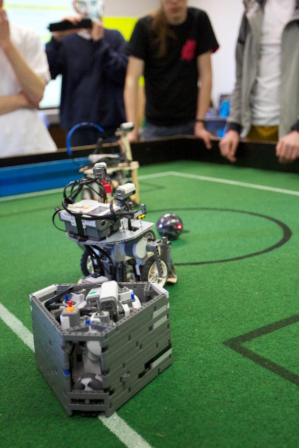 Players control their robots to play football at the Dutch national robot cup in Delft, the Netherlands, on April 20, 2013. (Xinhua/Sylvia Lederer) 