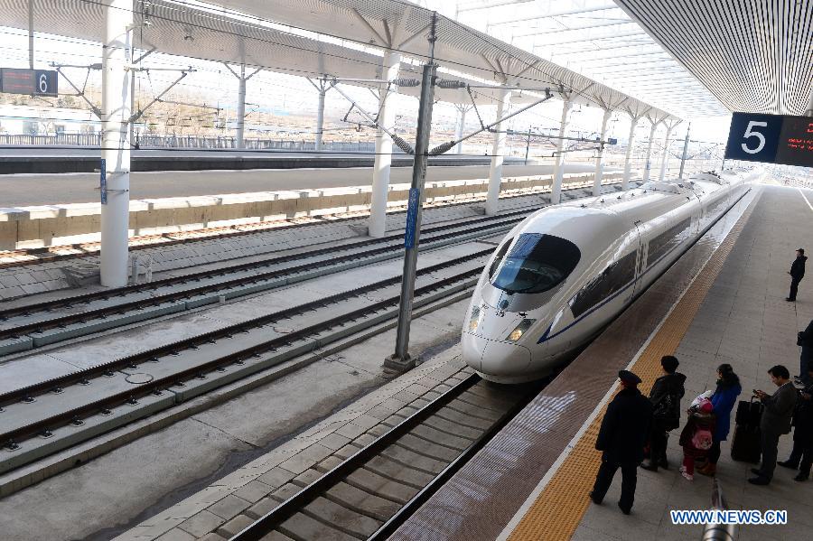 A Harbin-Dalian high-speed train pulls in at the Changchun West Railway Station in Changchun, capital of northeast China's Jilin Province, April 21, 2013. The Harbin-Dalian High-speed Railway, the world's fastest railway in frigid regions, started its summer schedule as of April 21, with the speed during the summer period (usually from April to November) lifted to 300 kilometers per hour from 200 in the winter period, cutting the shortest running time between Harbin and Dalian from five hours and 18 miniutes to three and half hours. The Harbin-Dalian high-speed railway was open for service on Dec. 1, 2012. (Xinhua/Lin Hong) 