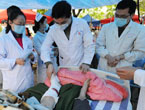 Doctors give treatment to injured people in Ya'an City 