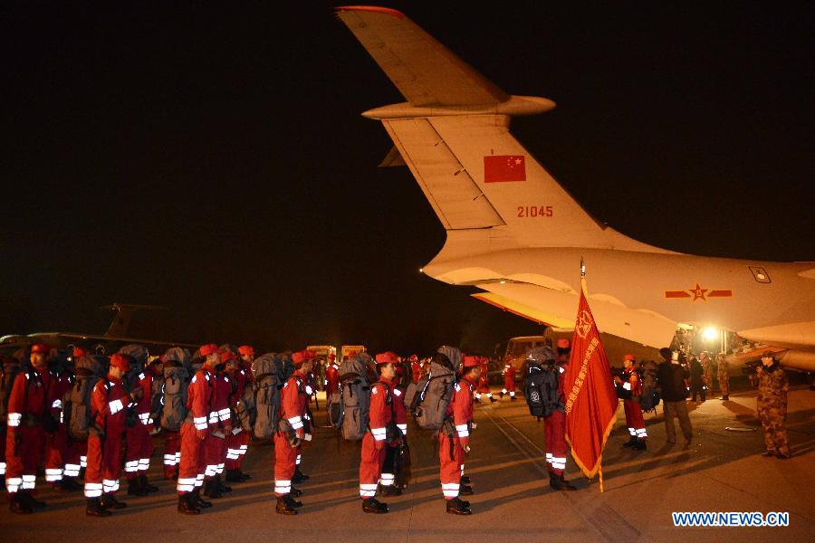 Members of China International Search and Rescue Team (CISAR) gather at Nanyuan Airport in Beijing, capital of China, April 20, 2013. A total of 140 rescuers and 12 sniffer dogs flew to the earthquake-hit Lushan County, southwest China's Sichuan Province, Saturday night to conduct rescue work. (Xinhua/Yu Hongchun) 