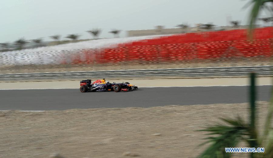 Red Bull driver Sebastian Vettel drives during the Bahrain F1 Grand Prix at the Bahrain International Circuit in Manama, Bahrain, on April 21, 2013. (Xinhua/Chen Shaojin)