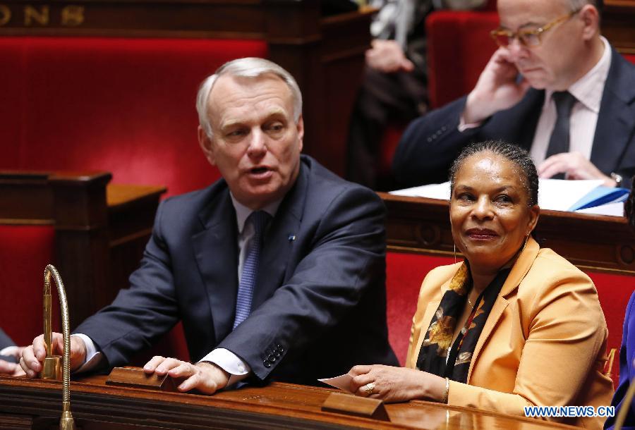 French Prime Minister Jean-Marc Ayrault (L) and Justice Minister Christiane Taubira the vote on same-sex marriage at the French Parliament in Paris, April 23, 2013. As the ruling Socialist Party (PS) enjoys an absolute majority at the National Assembly where 331 legislators voted for the bill and 225 voted against, it successfully paved the way for France to join dozens of other countries, mostly in Europe, to allow same-sex unions and adoption.(Xinhua/Etienne Laurent)