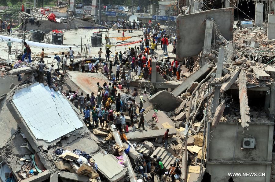 Rescuers work at the collapsed building in Savar, Bangladesh, April 24, 2013. At least 70 people were killed and over six hundred injured after an eight-storey building in Savar on the outskirts of the Bangladeshi capital Dhaka collapsed on Wednesday morning. (Xinhua/Shariful Islam) 