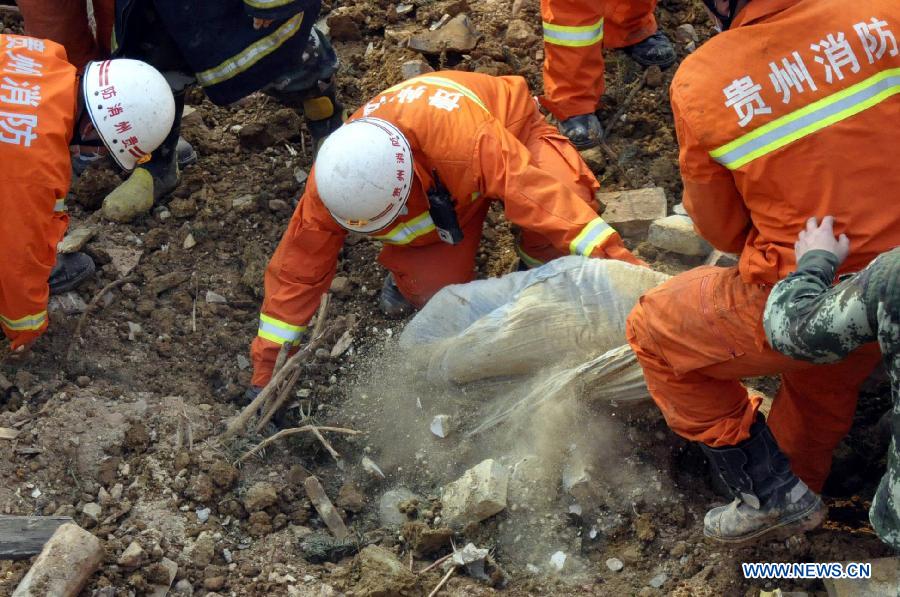 Rescuers work at the site of a landslide in Mawo Village near Bijie City, southwest China's Guizhou Province, April 27, 2013. Four villagers are confirmed dead and four others are missing after the landslide hit the village at 12:50 p.m. on April 27. (Xinhua/Luo Ji) 