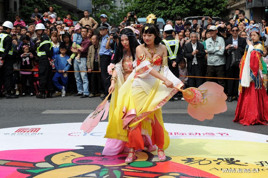 Cosplayers participate in a cartoon and animation floats parade during the ninth China International Cartoon & Animation Festival in Hangzhou, capital of east China's Zhejiang Province, April 28, 2013. (Xinhua/Ju Huanzong)  