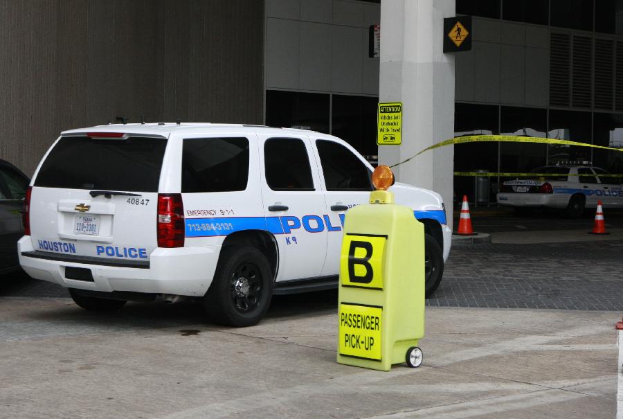 A police car is seen outside the Terminal B at the Bush Intercontinental Airport in Houston, the United States, May 2, 2013. Shots were fired Thursday at an airport in the U.S. state of Texas, a local TV station reported. (Xinhua/Song Qiong) 