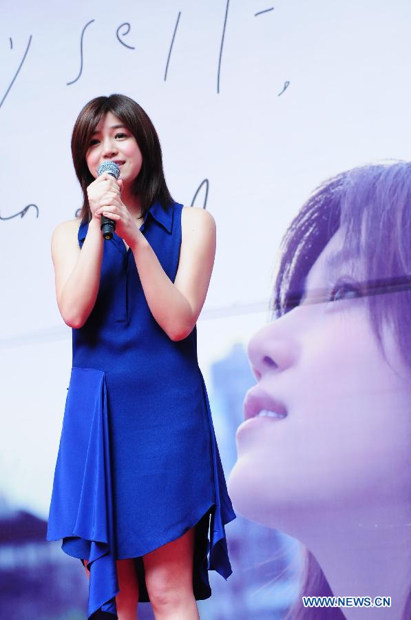 Actress Michelle Chen performs during a signing promotion event for her new album "Me, Myself and I" in Taipei, southeast China's Taiwan, May 5, 2013. (Xinhua)