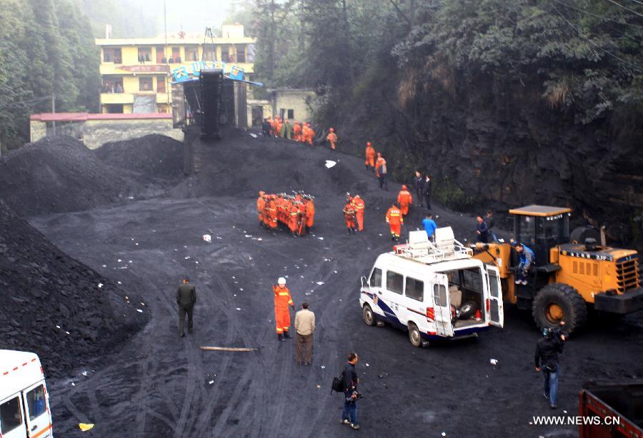 Rescuers work at the Dashan coal mine where a colliery gas explosion occurred in Pingba County, southwest China's Guizhou Province, May 11, 2013. Twelve people were killed and two others injured in the explosion on the evening of May 10. (Xinhua)