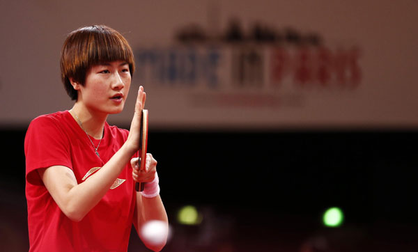 Chinese table tennis star Ding Ning practices during a training session at the Palais Omnisports de Paris-Bercy in Paris, on May 13, 2013, as China's table tennis team receive training in preparation for the 52nd edition of the World Table Tennis Championships. (Photo/Xinhua)