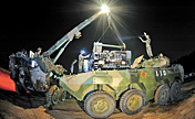 Troops in night equipment support drill