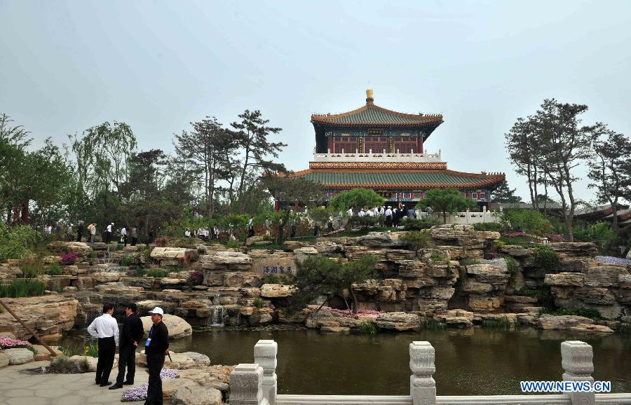 Photo taken on May 18, 2013 shows a view of Beijing Park in the 9th China (Beijing) International Garden Expo in Beijing, capital of China. The expo opened in southwestern Fengtai district in Beijing on Saturday and will last till Nov. 18, 2013. Garden designs from 69 Chinese cities and 29 countries will be presented. (Xinhua/Li Wen)