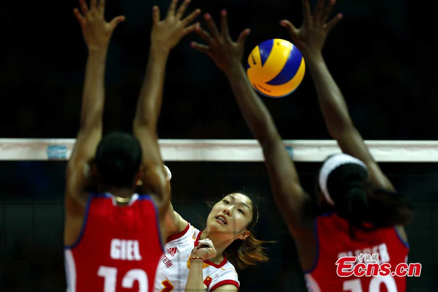 Chinese volleyball players are in a match against Puerto Rico in Ningbo, Zhejiang Province, May 19, 2013. The Chinese team, which was formed last week, proved a class above their opponents and won the match 25-12, 25-20, 25-14 in just one hour and 11 minutes at the Beilun International Volleyball Tournament. (CNS/Fu Tian)