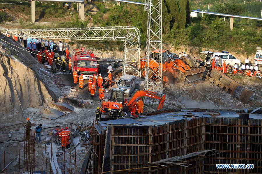 Rescuers search for survivors at the ruins of the Poly Explosives (Jinan) Co., Ltd., a professional manufacturer of civil explosive materials, after an explosion in Zhangqiu, east China's Shandong Province, May 20, 2013. Thirteen out of the thirty-four workers who had been pulled out of the rubble were confirmed dead in the accident that occurred Monday morning. (Xinhua/Xu Suhui) 