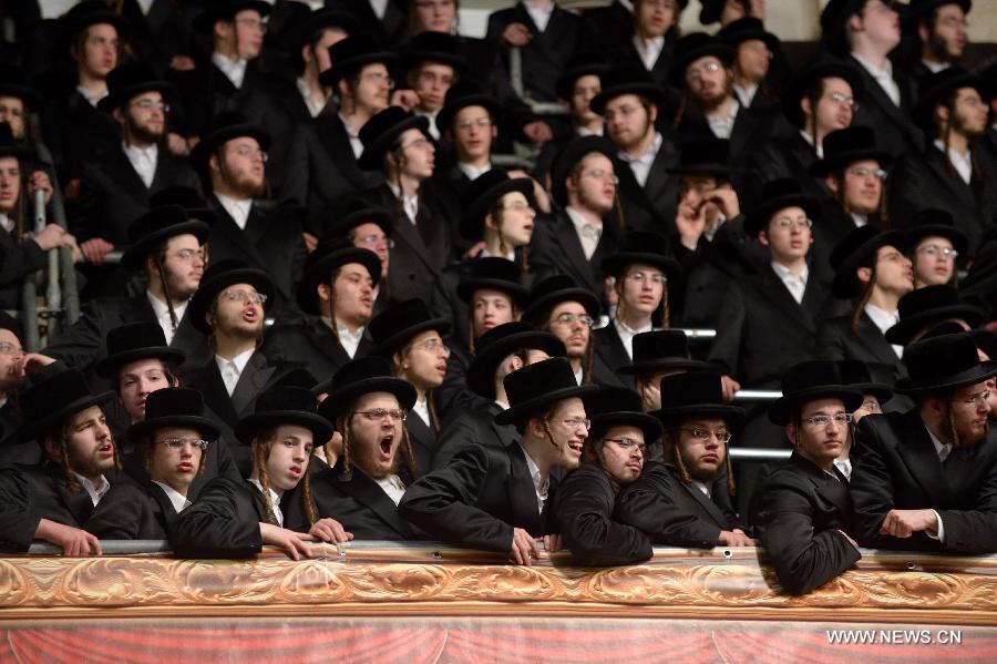 Jews of the Belz Hasidic Dynasty watch the wedding ceremony of Rabbi Shalom Rokeach, the grandson of the Belz Rabbi Yissachar Dov Rokeach, at the neighbourhood of Kiryat Belz in Jerusalem on May 21, 2013. More than 10,000 Jews participated in the wedding. (Xinhua/Yin Dongxun) 