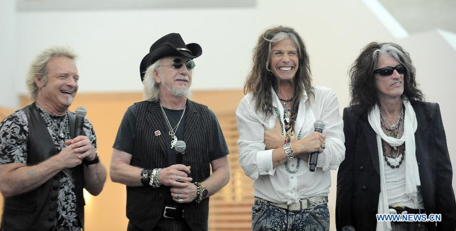Joey Kramer, Brad Whitford, Steven Tyler and Joe Perry, members of the American rock band Aerosmith, attend a press conference for the Social Star Awards in Singapore's Marina Bay Sands Theatre, on May 22, 2013. The inaugural Social Star Awards ceremony will be held Thursday in Singapore and the Singapore Social Concerts will be held in Singapore on May 24 and May 25. (Xinhua/Then Chih Wey) 