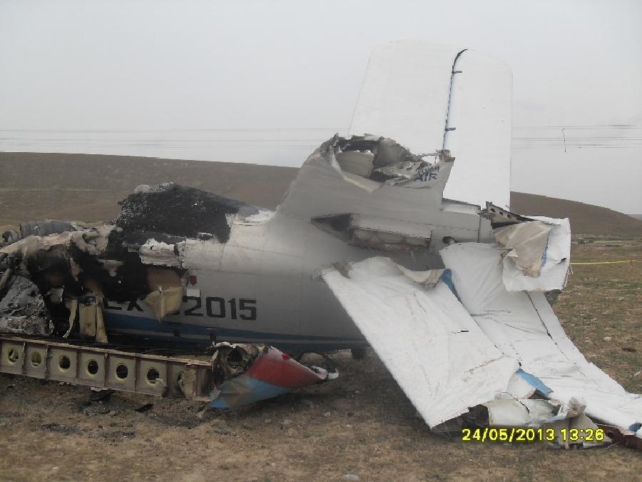 Photo taken on May 24, 2013 shows the wreckage of an AN-2 plane crashed in Jalal-Abad region, Kyrgyzstan. The aircraft crashed here Friday, killing three. (Xinhua) 
