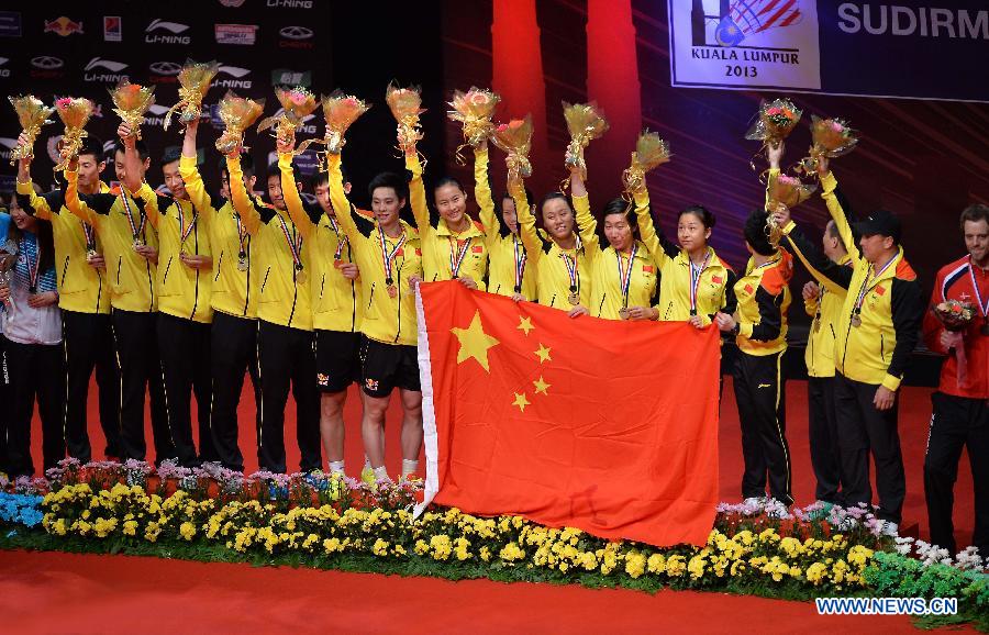 Players of China celebrate during the awarding ceremony after the final match against South Korea at the Sudirman Cup World Team Badminton Championships in Kuala Lumpur, Malaysia, on May 26, 2013. Team China won the champion with 3-0. (Xinhua/Chen Xiaowei)